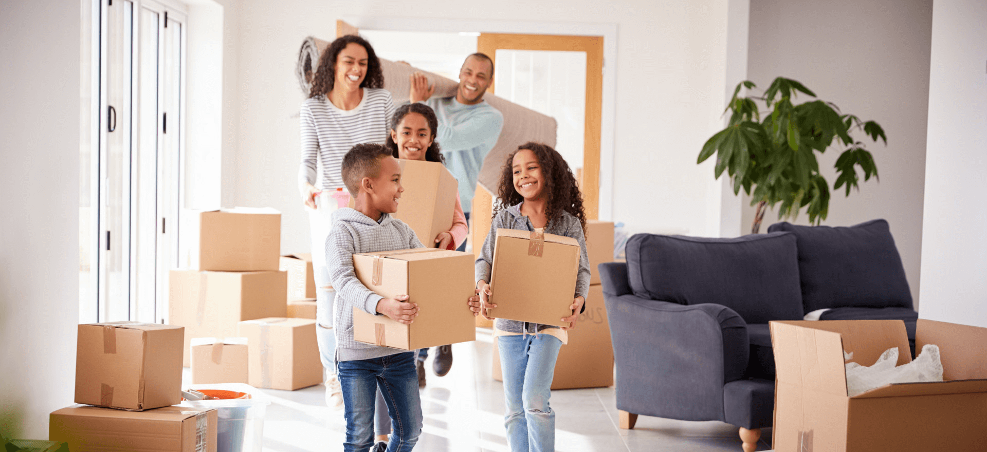 Happy family moving in to their new home thanks to Raystar Mortgage Group INC