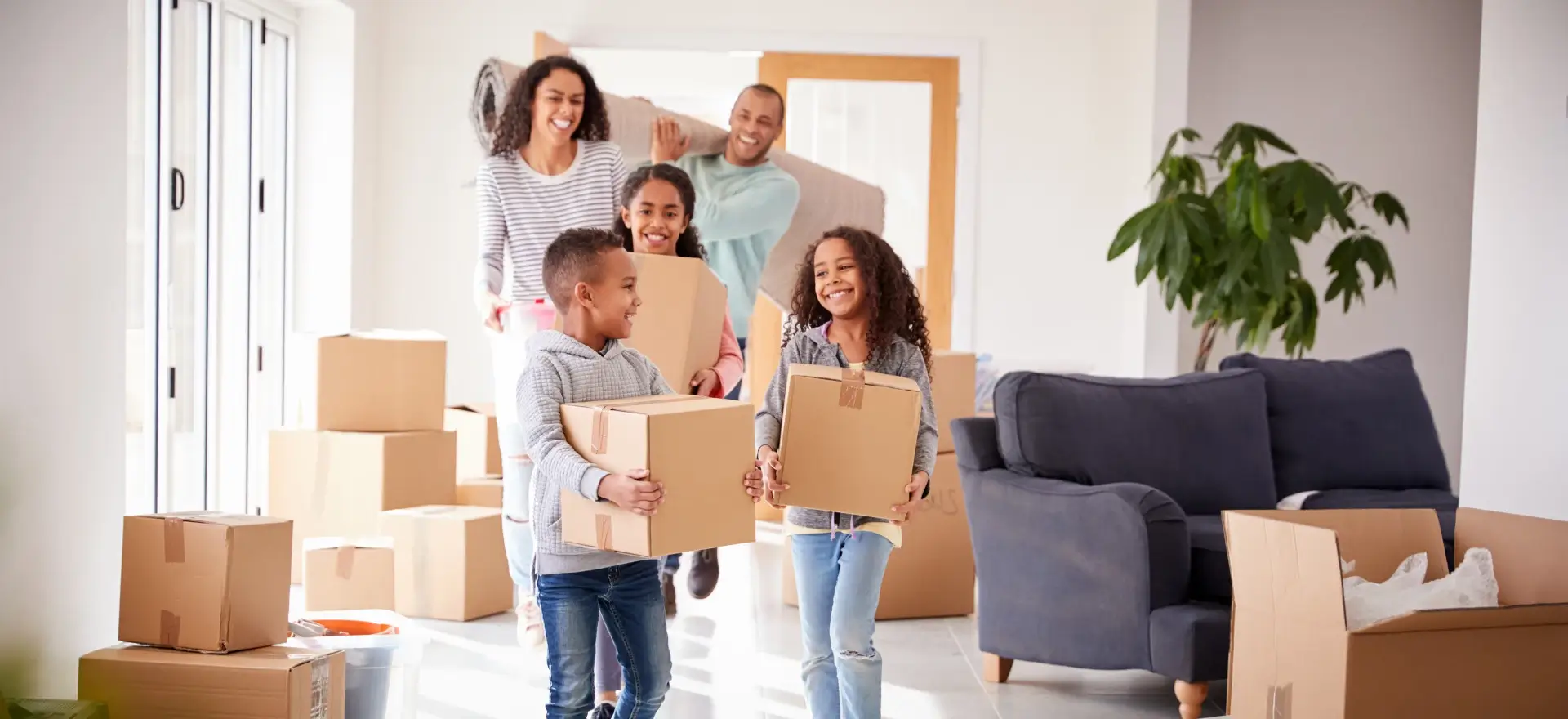 Happy family moving in to their new home thanks to Raystar Mortgage Group INC